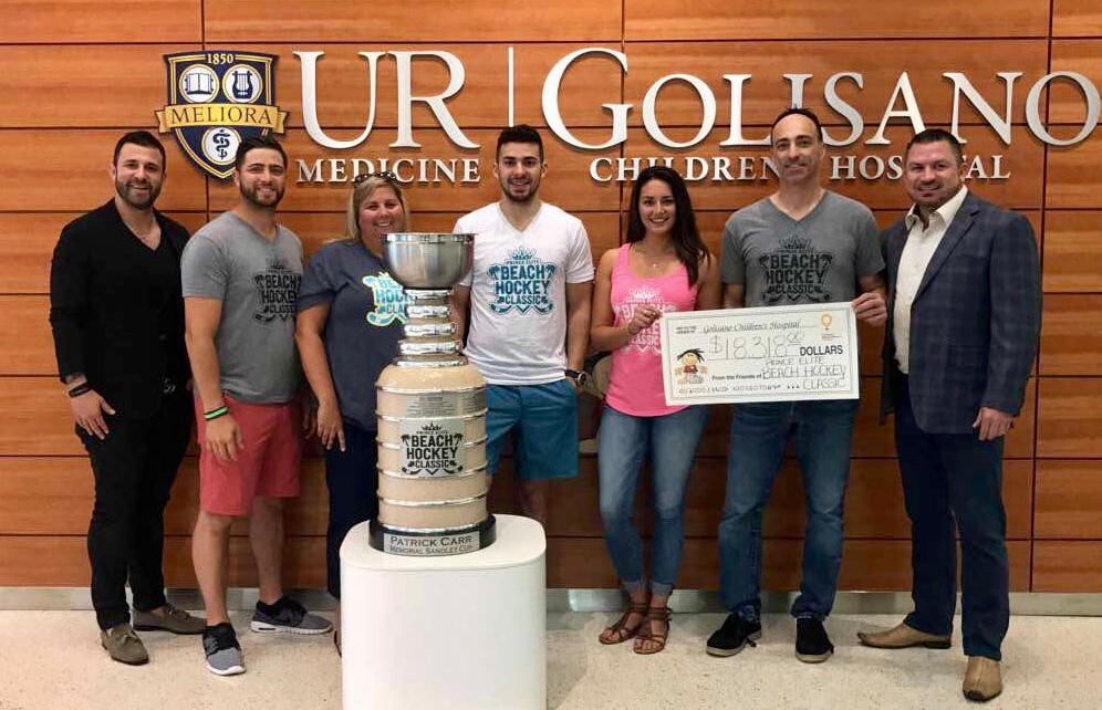 Beach Hockey Classic board presents check to Golisano Children’s Hospital